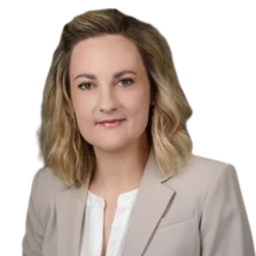 Professional headshot of a woman with blonde hair wearing a beige blazer, looking at the camera.